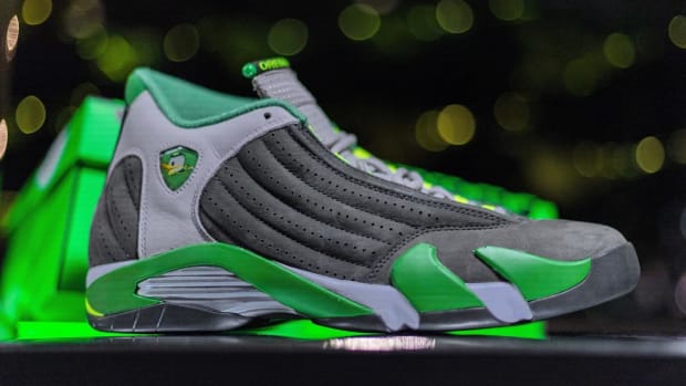 Green, grey, and yellow Air Jordan shoes.